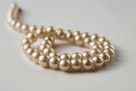 Pearl necklace on white background, close-up. Luxury female jewelry,の写真素材