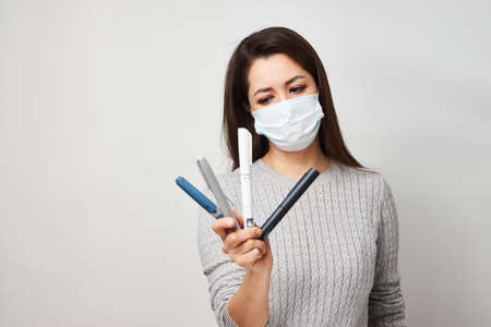 Young woman with insulin injection pen, close-up portrait. Diabetic patient with insulin pen for...