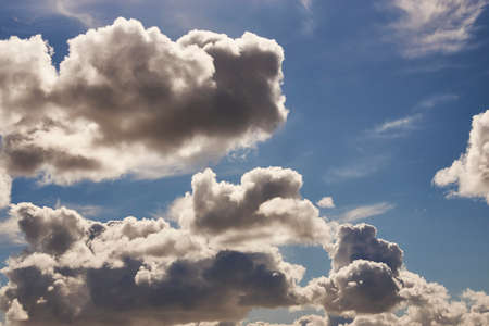 Blue sky with fluffy cloud. Nature landscape background with beautiful clouds and sky