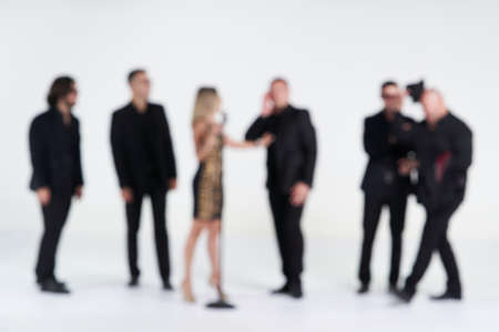 Blurred portrait of Diverse people group on white background. Group of happy young people standing...