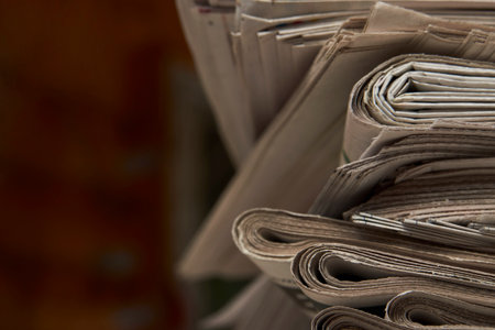 Stack of newspaper, close-up. Journalism concept. Pile of newspapersの写真素材