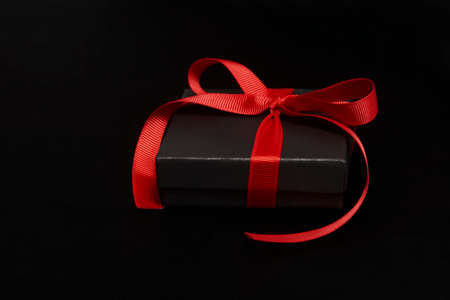 Black friday sale concept with gift box with ribbon, close-up