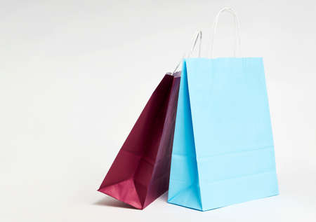 Colorful paper shopping bags on white background with copy space.の写真素材