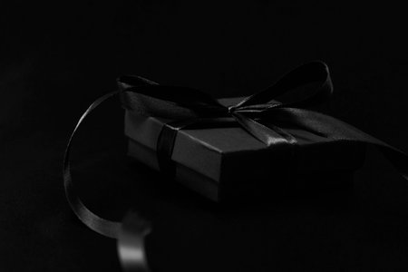 Black friday sale concept with gift box with ribbon, close-upの写真素材