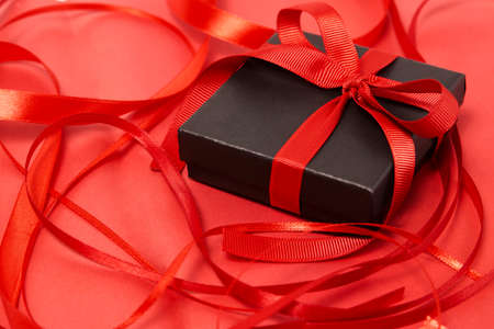 Black friday sale concept with gift box with ribbon, close-up