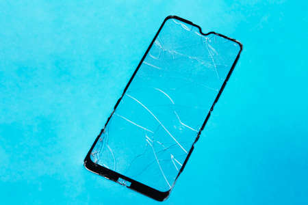 Broken protective glass for mobile phone. Smartphone tempered glass shieldの写真素材