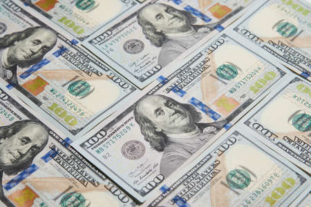 US dollars banknotes background. A pile of one hundred American dollars bills, close-upの写真素材