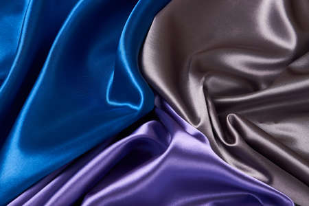 Colorful silk fabric background, top view. Satin cloth texture can use as abstract background with copy spaceの写真素材