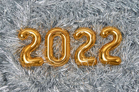 Christmas tree tinsel as 2022 New Year background. Christmas composition and decoration.の写真素材