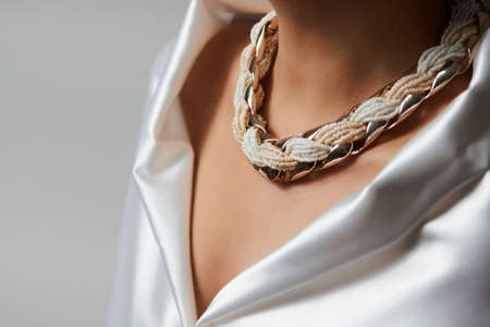 Woman necklace, beauty and accessories. Pearl necklace on a woman neck, close-upの写真素材
