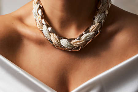 Woman necklace, beauty and accessories. Pearl necklace on a woman neck, close-upの写真素材