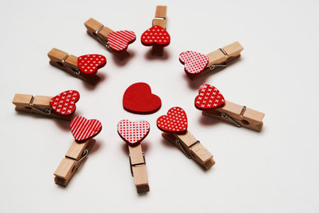 Clothespin with red heart on a white background with copy space for text. Love and Valentines day...