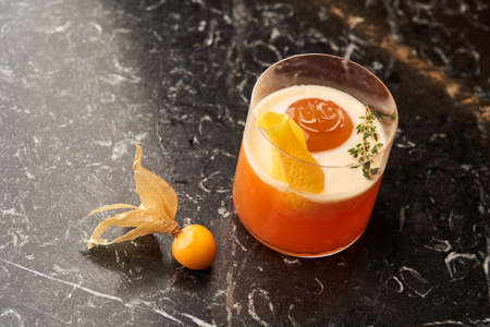 Fresh cocktail glass on marble table. Alcohol cocktail drink, close-up.の写真素材