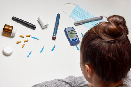 Diabetes and Coronavirus. Insulin pen, diabetic syringe, blood sugar test and medical face mask....