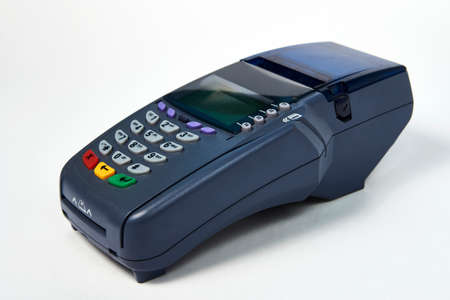 Payment terminal on white background with copy space. Credit card reader for buying selling....