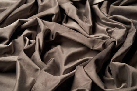Beige fabric background, view from above. Pastel beige cloth texture can use as abstract background...