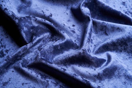 Dark blue fabric background, view from above. Smooth elegant blue cloth texture can use as abstract background with copy space, close-upの写真素材