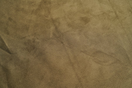 Beige fabric background, view from above. Pastel beige cloth texture can use as abstract background with copy space, close-upの写真素材