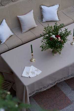 Beautiful table setting with napkin. Table decoration with plate, napkin and candle