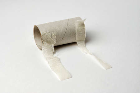 Empty toilet paper roll isolated on white background with copy space, close-upの写真素材