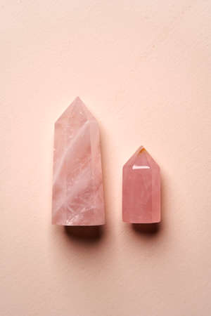 Crystal stone on pink background with copy space, top view. Mineral stoneの写真素材