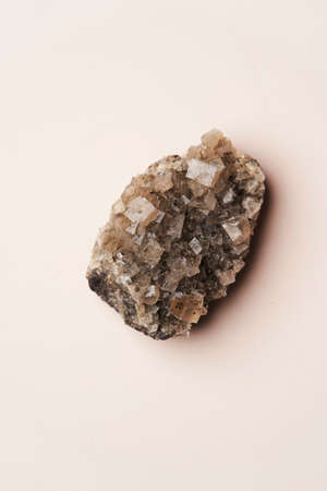 Crystal stone on pink background with copy space, top view. Mineral stoneの写真素材