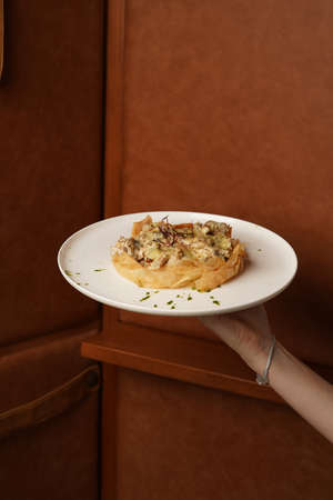 Fried shrimps and mushrooms with creamy cheese sauceの写真素材