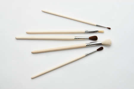 Paint brushes isolated on a white background with copy space, close-up