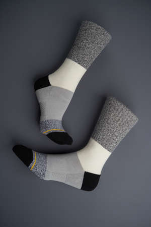 Colorful socks on gray background, close-up. Sport socksの写真素材