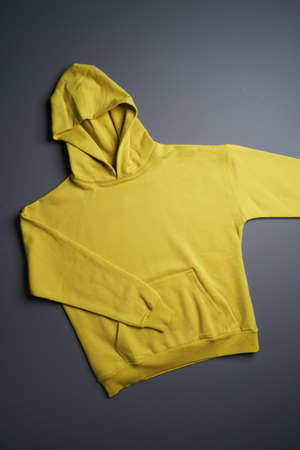 Hoodie sweatshirt with long sleeve. Blank hoodie on gray background, top viewの写真素材