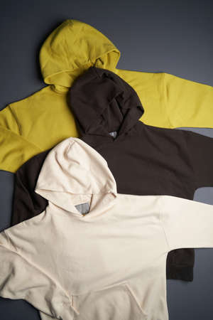 Hoodie sweatshirt with long sleeve. Blank hoodie on gray background, top view