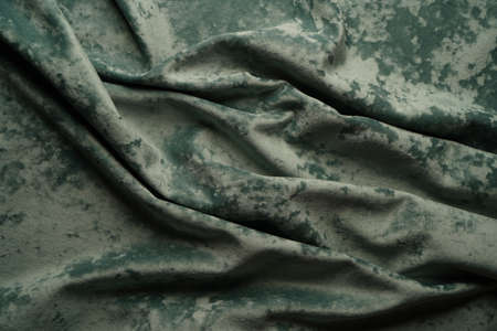Green fabric background, view from above. Smooth elegant green luxury cloth texture can use as abstract background with copy space, close-upの写真素材