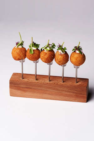 Fried Cheese balls, close-up. Snack cheese balls on white background with copy space.