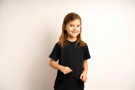 Happy child on white background with copy space. Portrait of a cute smiling girl , close-upの写真素材