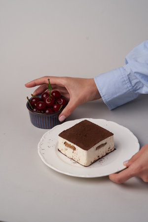 Souffle cake with chocolate and cherry. Piece of Chocolate cake bird's milkの写真素材