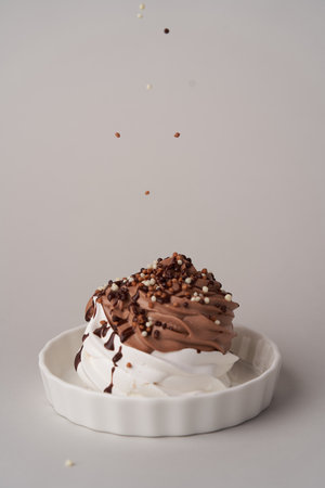 Cupcake with meringue and chocolate. Whipped cream mini cakeの写真素材