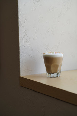 Latte art coffee glass or cappuccino froth, close-up