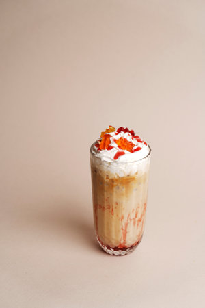 Milkshake cocktail glass with syrup and gummy bear candyの写真素材