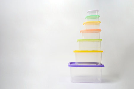 Colorful plastic containers on white background, close-upの写真素材