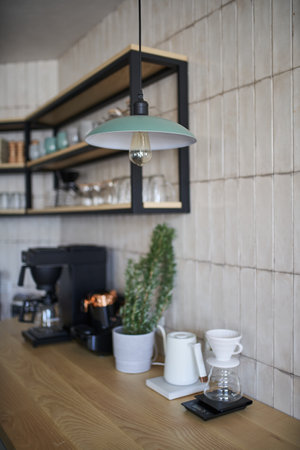 Kitchen interior with coffee machine and shelves with coffee cupsの写真素材