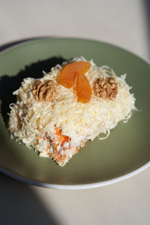 Mimosa salad with vegetables, eggs and cheese. Traditional russian salad Mimosaの写真素材