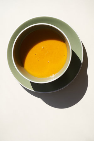 Lentil cream soup bowl, white background with copy space. Vegetarian soupの写真素材