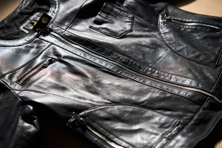 Black leather jacket background, close-up