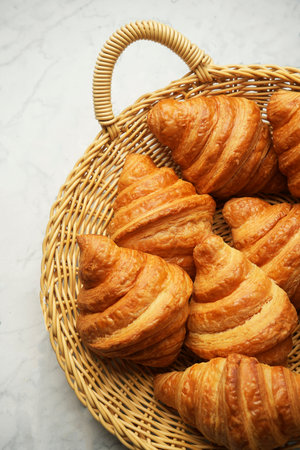 Fresh croissant background, close-up. French croissant for breakfastの写真素材
