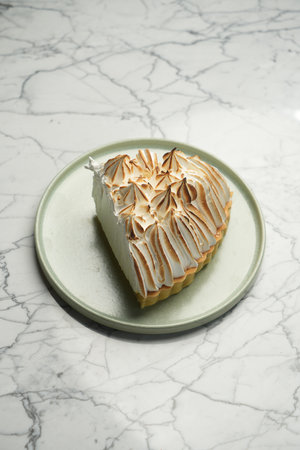 Tasty lemon meringue pie cake on plate, close-upの写真素材