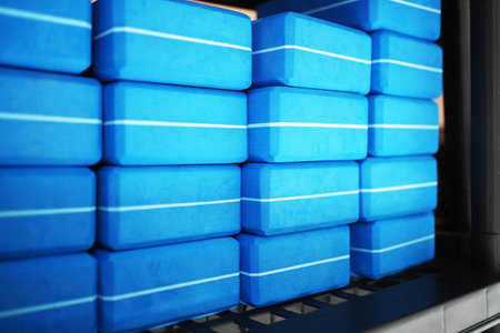 Yoga Block stacked on shelf, close-up. Yoga brick background, blue colorの写真素材