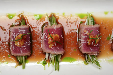 Traditional Japanese Sushi with tuna and celery in sauce