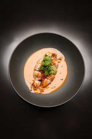 Baked squid stuffed with vegetables and sauce. Stuffed calamari, traditional asian foodの写真素材