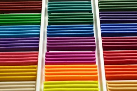 Colorful plastilin background. Pieces of multicolor plasticine modeling clay, close-upの写真素材