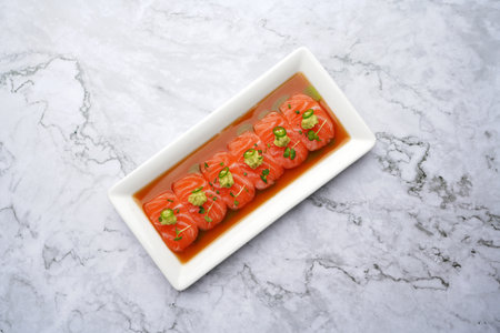 Tiradito salmon, Traditional Japanese food. Salmon appetizer with soy sauce and chiliの写真素材